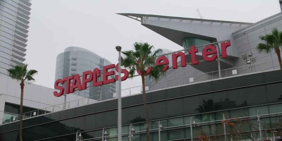 A stadium is shown in a downtown city