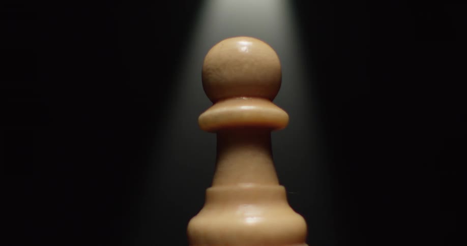 Chess piece rotates under a bright light