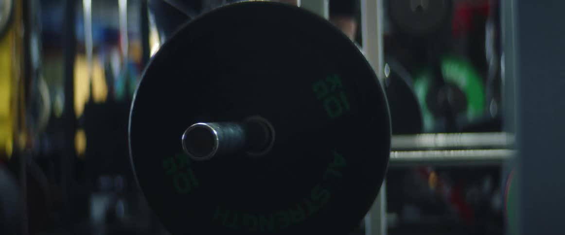 A person lifts weights indoors