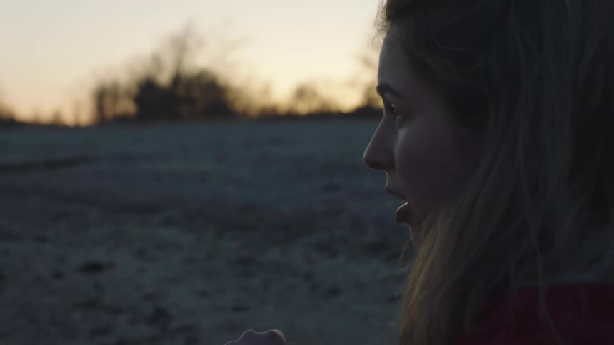 A woman is talking and taking photographs
