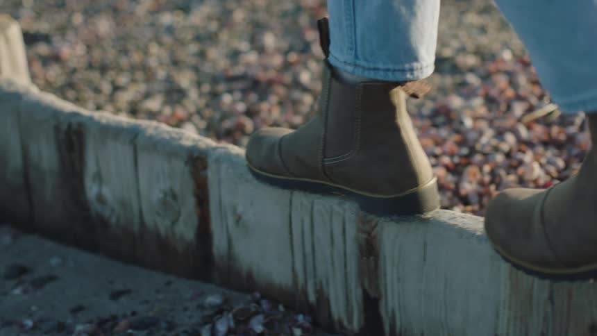 A person walking outdoors during the day
