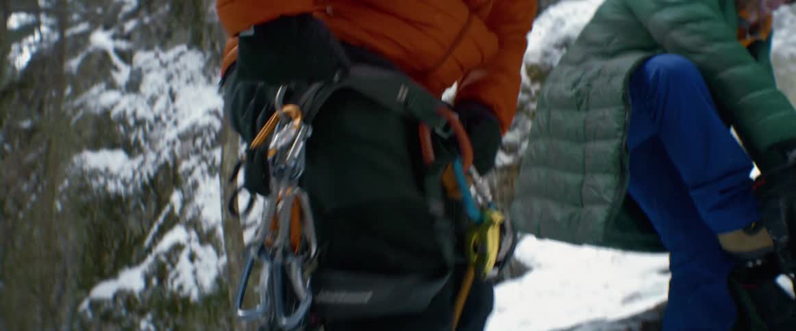 Two rock climbers gear up