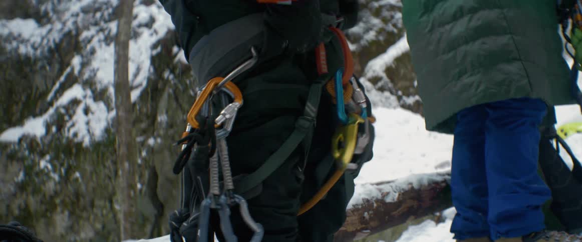 People are putting on their rock climbing gear