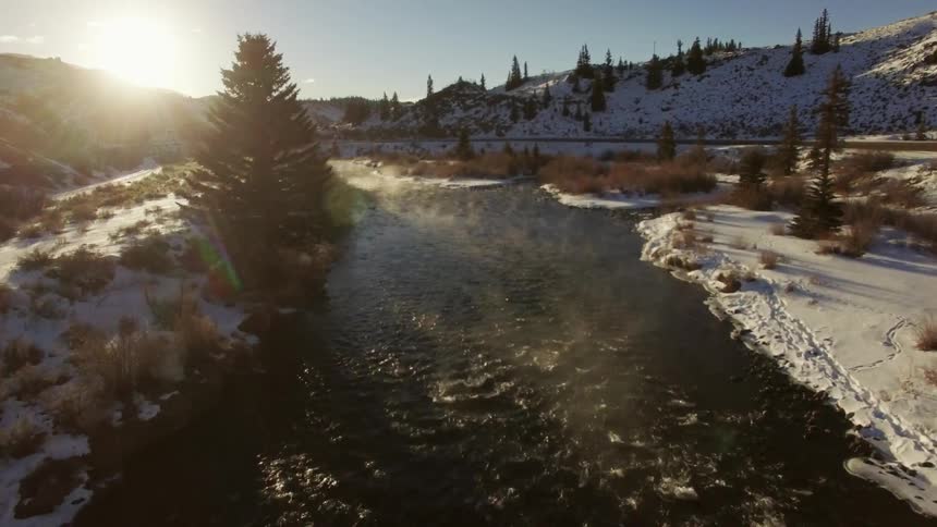 A river cutting through a snowy area