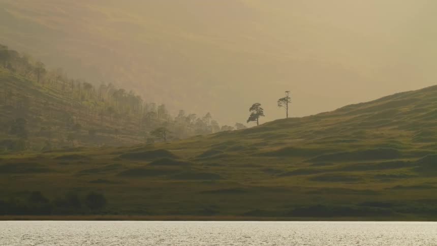 A view of the coast with hills