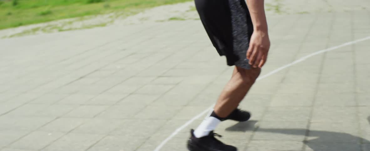 A man tries to dunk the ball but misses