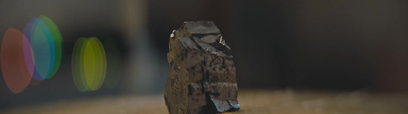 Close up view of a piece of iron pyrite sitting on a table