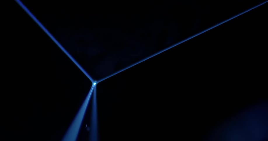 A blue light beam creates a corner against a black background