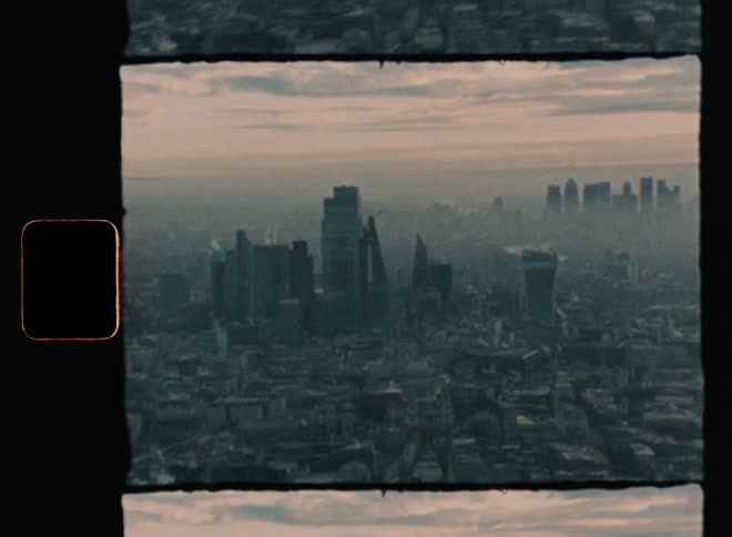 Aerial vintage footage of smog covered metropolis city