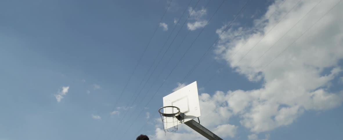 A man spins and shoots the basketball