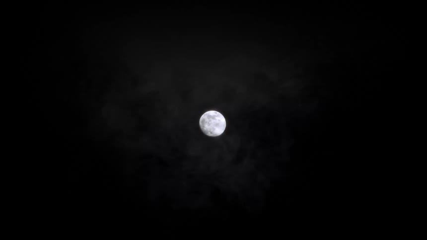 A full moon shines brightly in the night sky