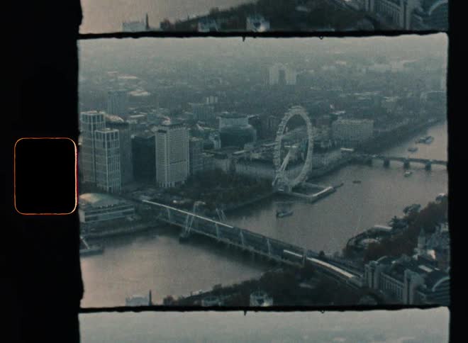 An aerial view of a city next to a river