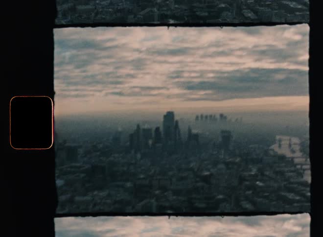 Aerial view of office buildings and houses near the river at dawn