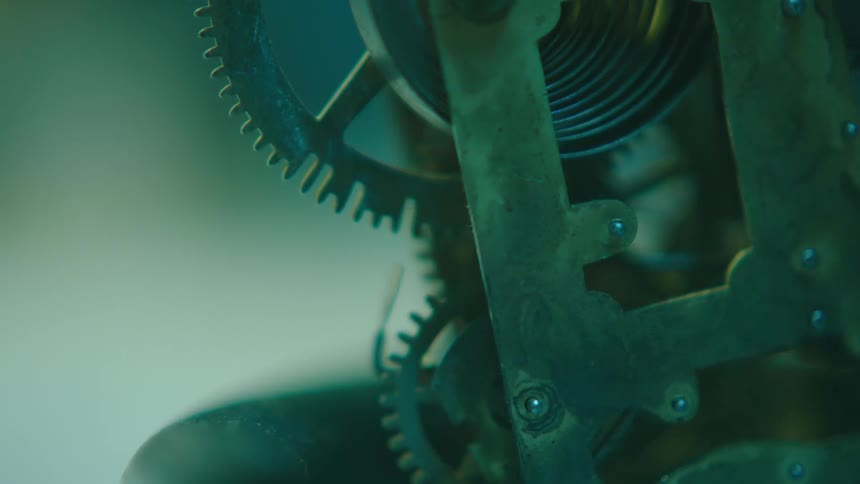 The gears of a mechanical device are turning