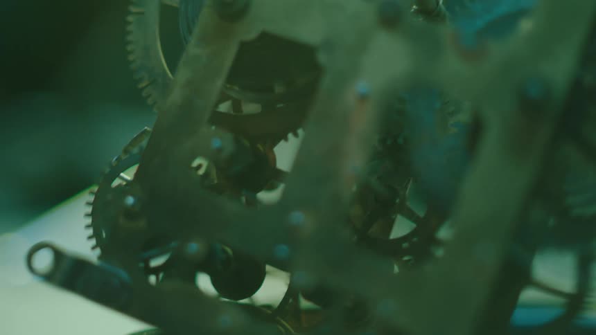 The gears of a mechanical device are turning