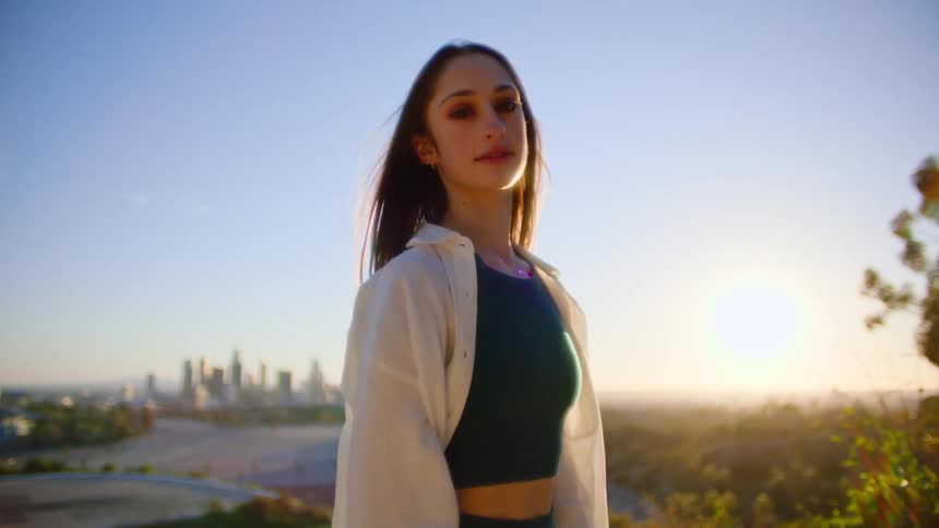 A portrait of a woman standing outdoors