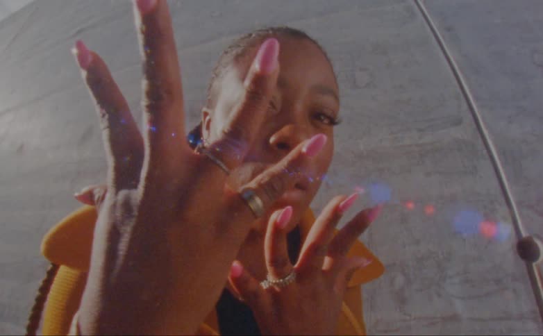 A woman is displaying her nail polish