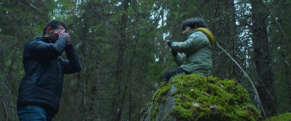 A view of a man and child out on a hike