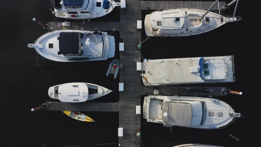 The boats are docked on the pier