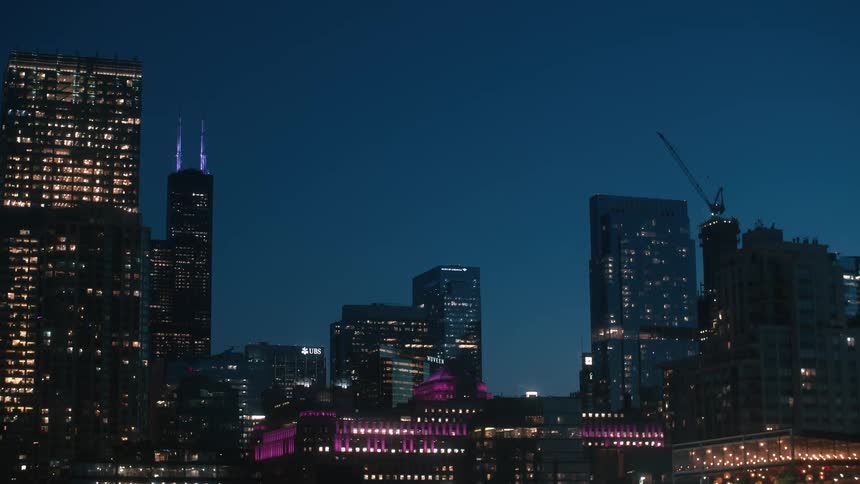 Illuminated skyscrapers and tall buildings in the city at night