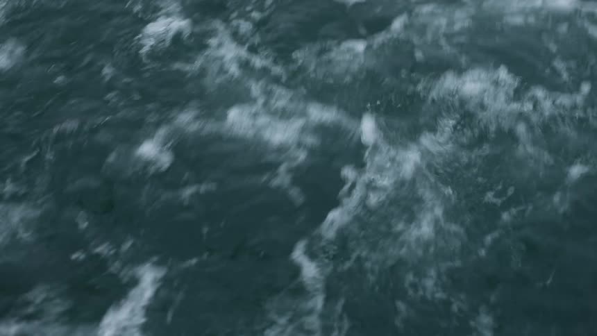Rough water splashes and moves wildly