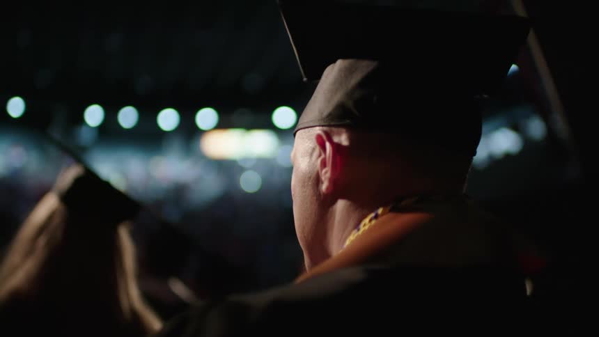 Two people going into a graduation
