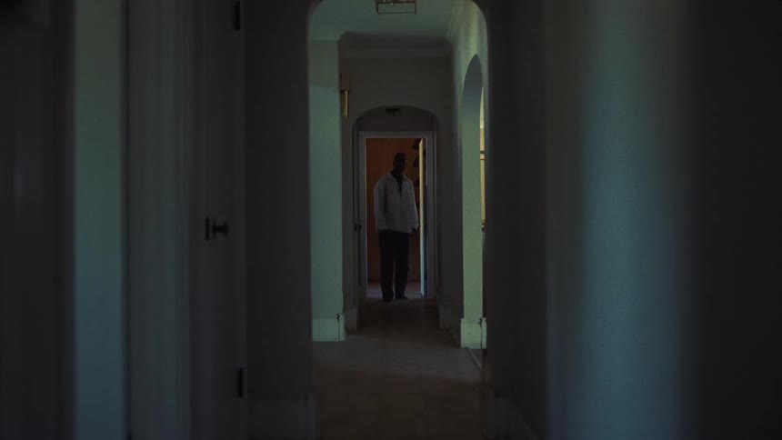 A view of a man walking down a hallway