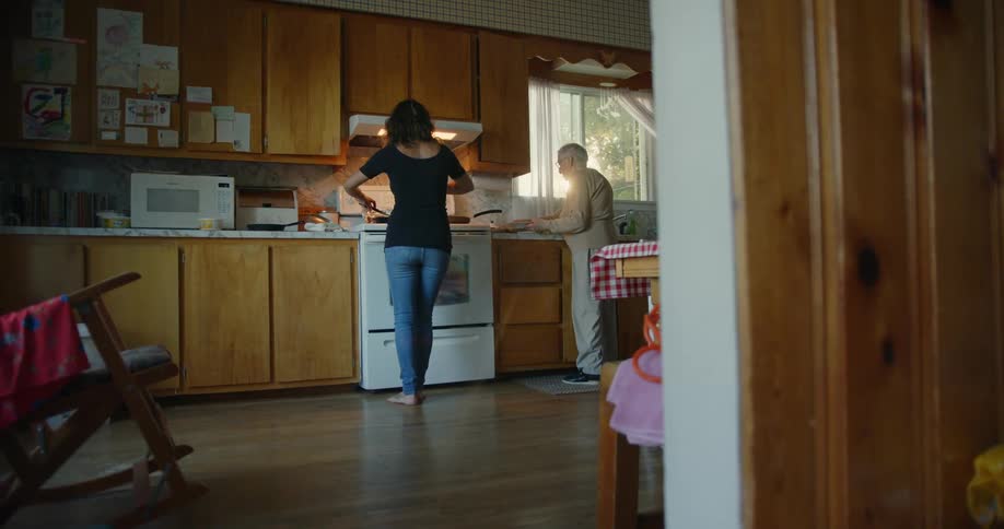 Grandmother and granddaughter cooking together