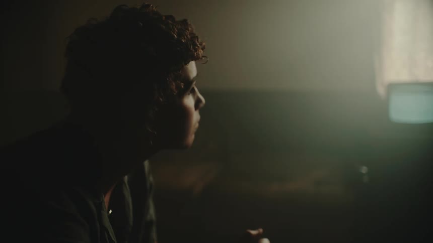 A view of a person sitting in a room