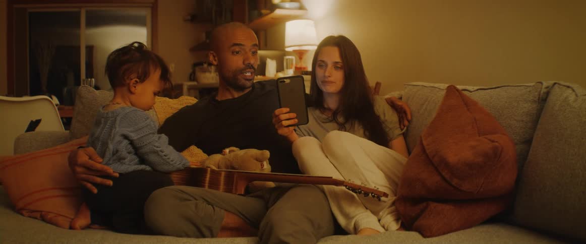 A family sitting together on a couch
