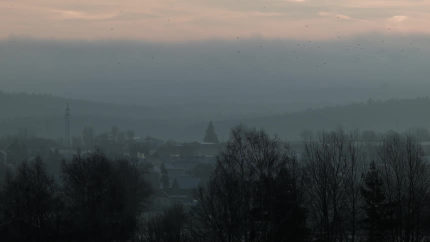 Clouds float over a chilly town scene at sunrise