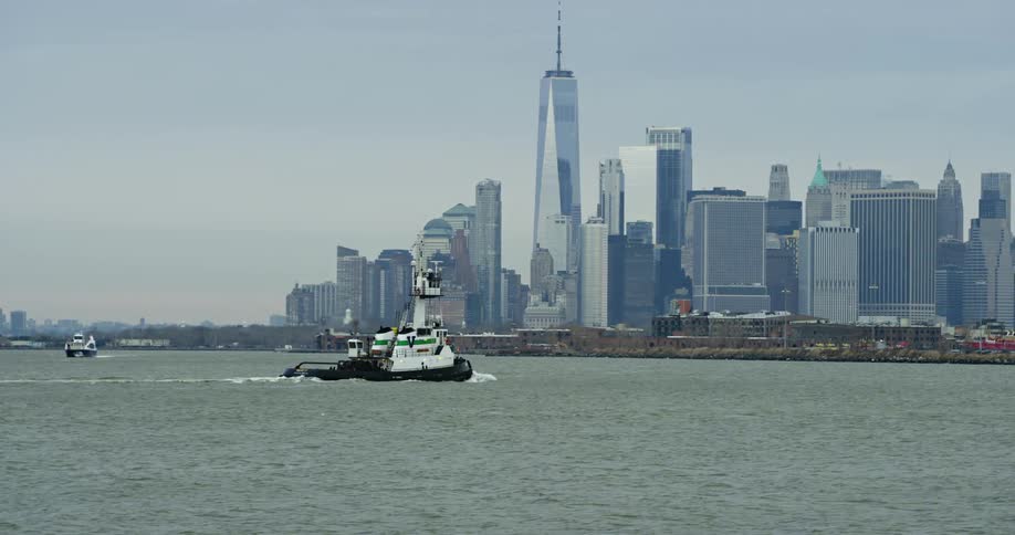 A ship travels past the city