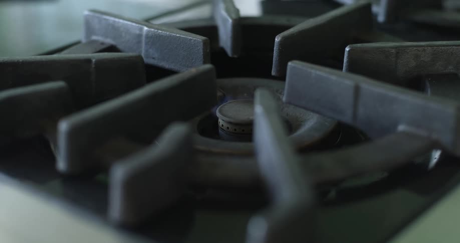 A view of a bruner lighting on a cooktop