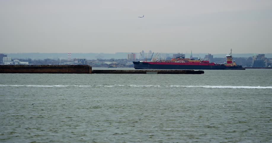 A boat is racing in the ocean