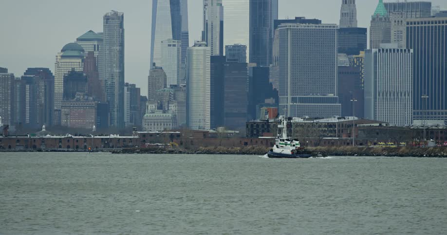 The ship travels past the city