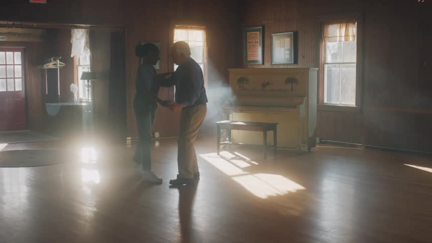 A man and woman dance together