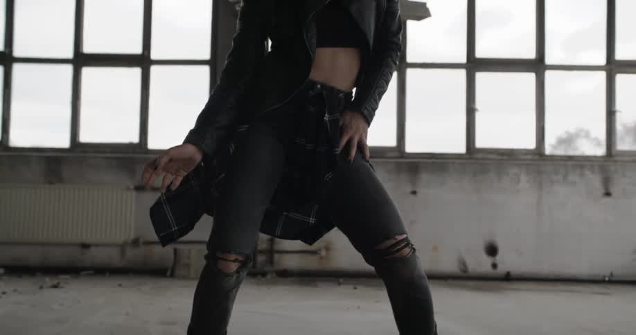 Woman dancing in an abandoned building