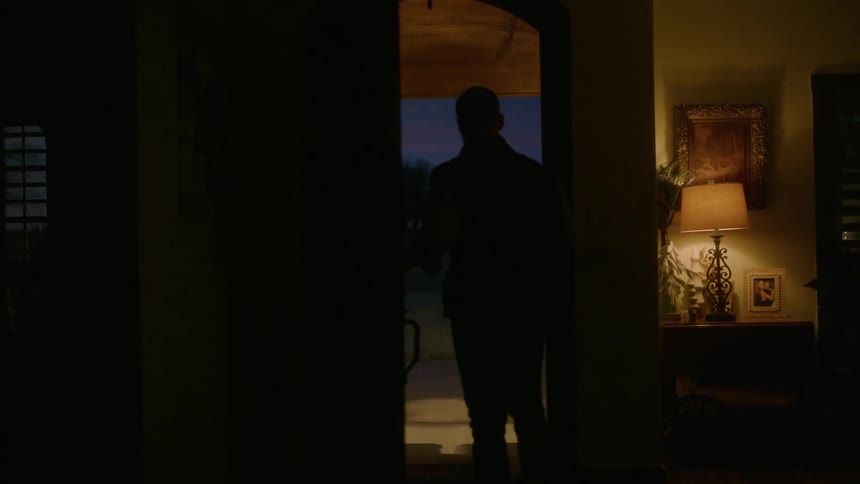 A man walks out of his house