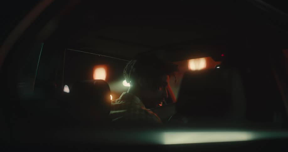 A man is sitting in the front seat of the car