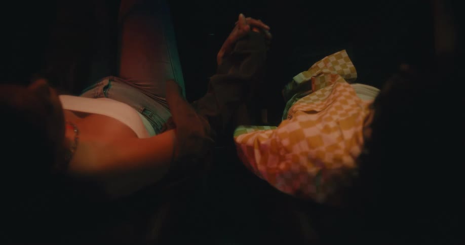 Overhead view of female reaching out to hold males hand
