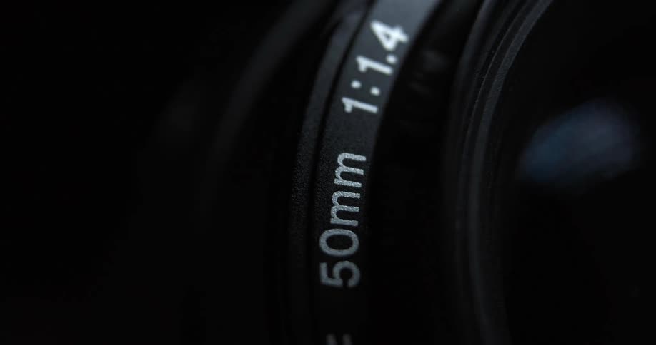 Light reflects off a camera lens