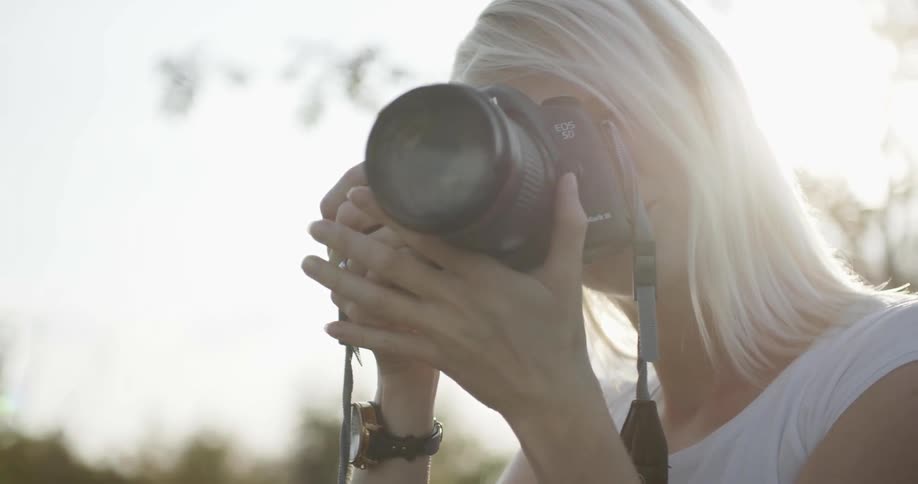 A woman is taking photographs