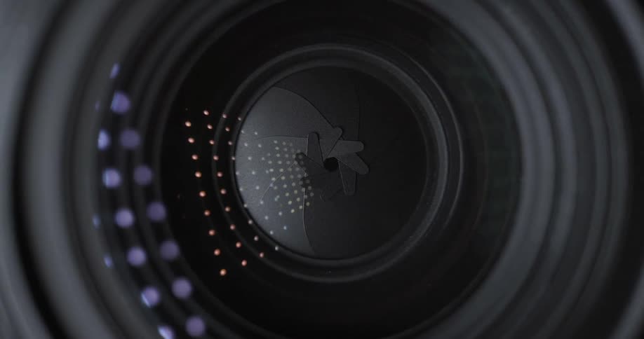 Close-up of a camera lens opening and closing