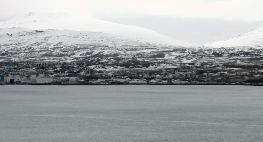 Snow covered mountain above a lake