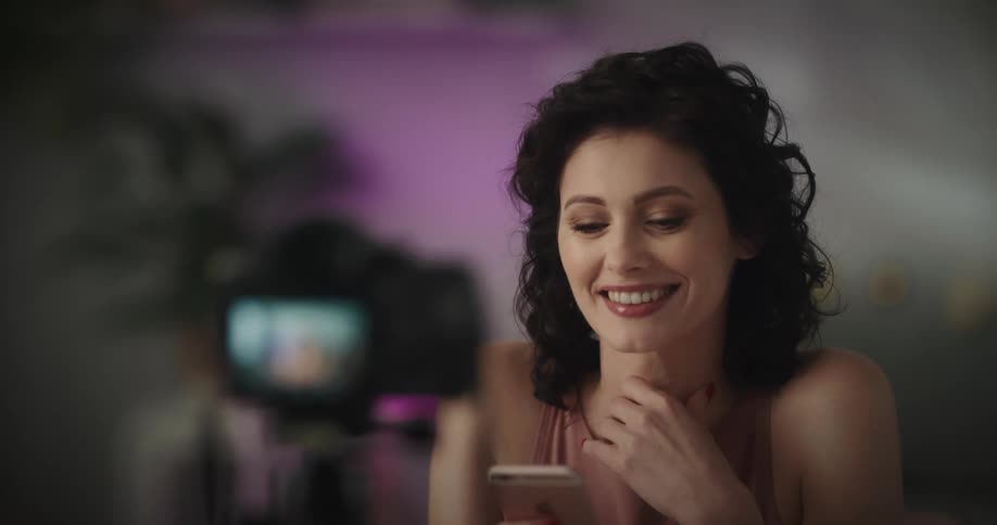 A woman films herself talking