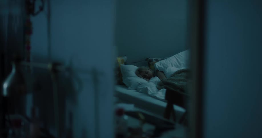 Mirror reflection of a young white woman sleeping in her bedroom
