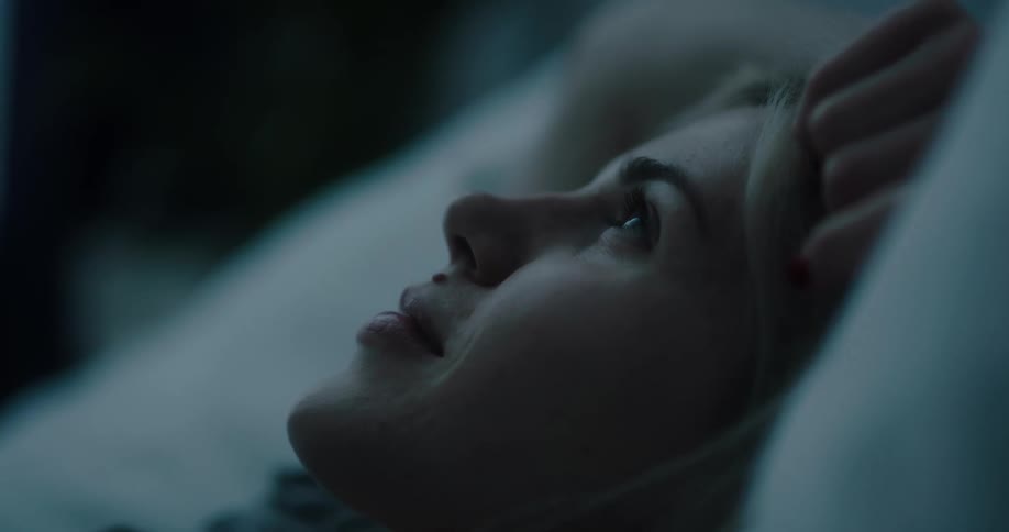 A woman laying in a bed