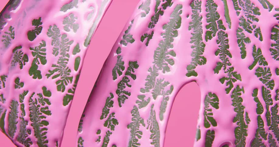 Bright purple liquid ink over the leaf of a plant in front of a pink background
