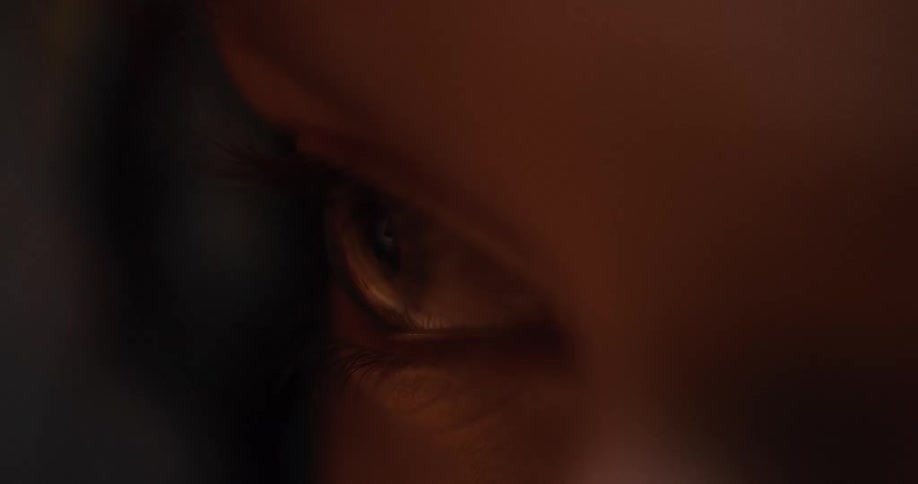 Light shines on an open eye then it blinks as the light moves away