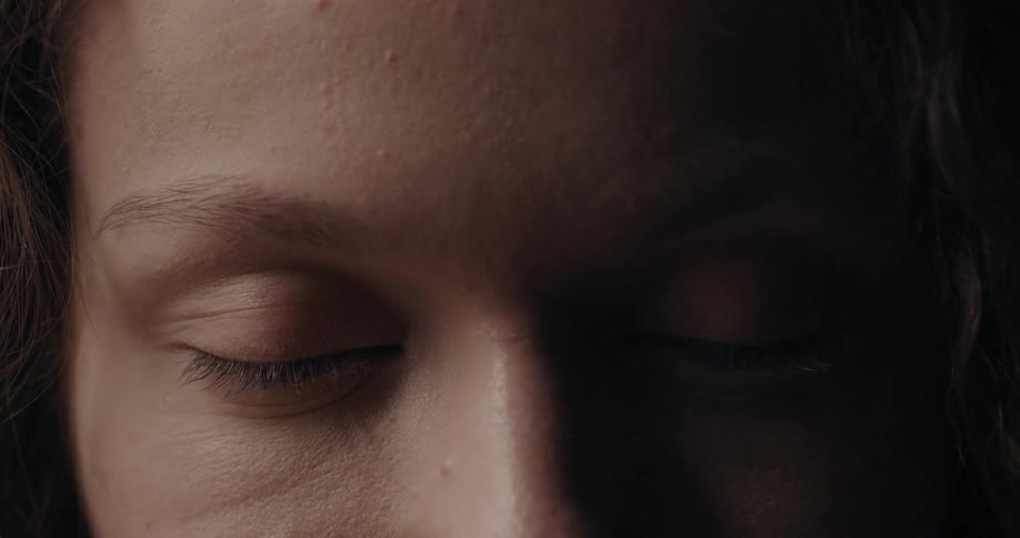 Close up of womans face with eyes closed